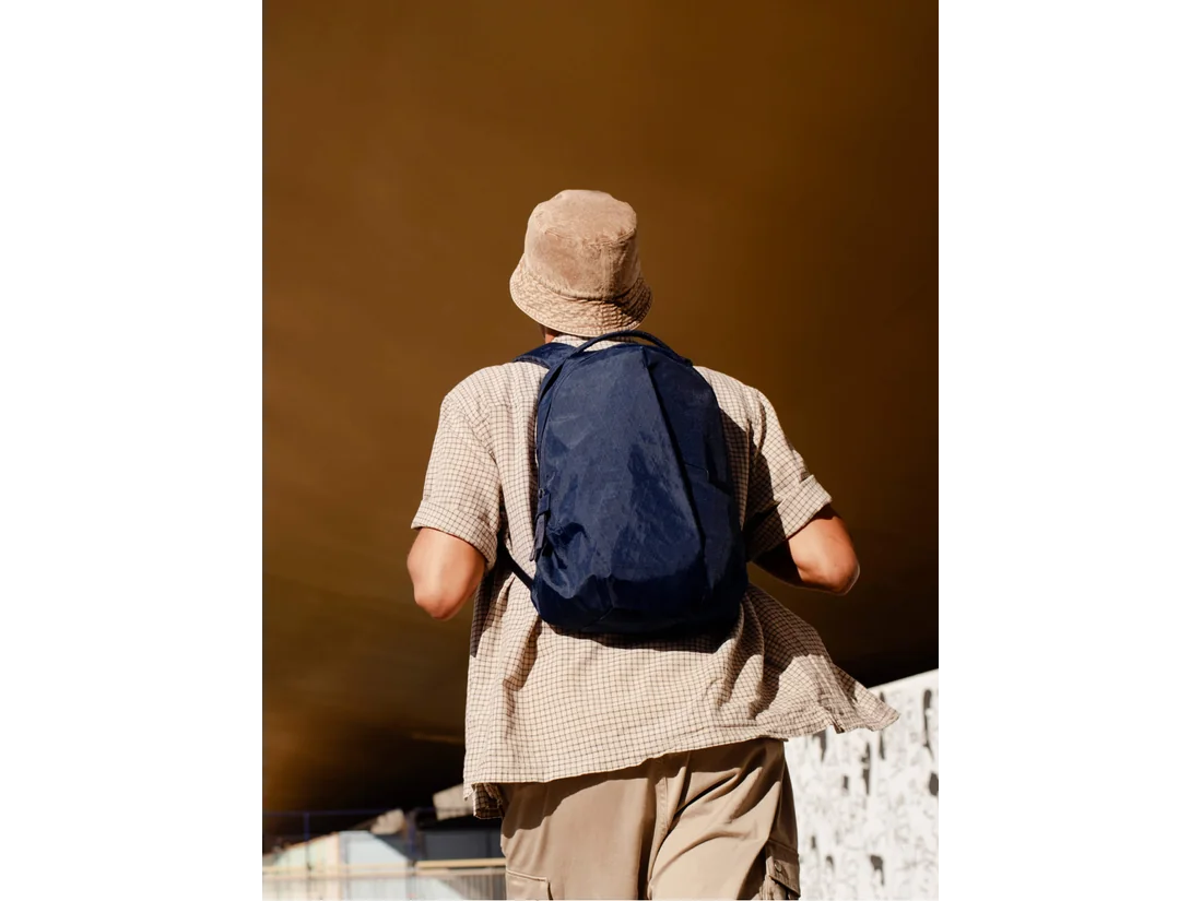 Able Carry Thirteen Daybag worn as a compact daily backpack