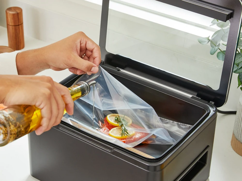 Anova chamber vacuum sealer open with food bag inside