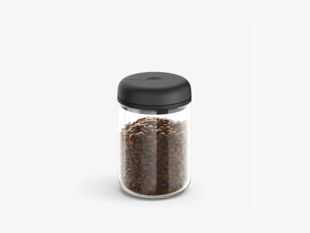 Fellow Electric Atmos clear canister with coffee beans