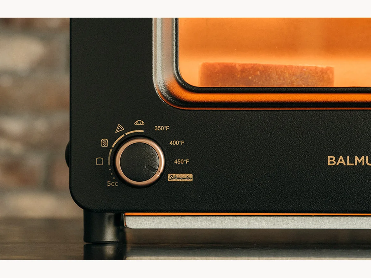 Close-up of BALMUDA The Toaster Pro dial and glowing window