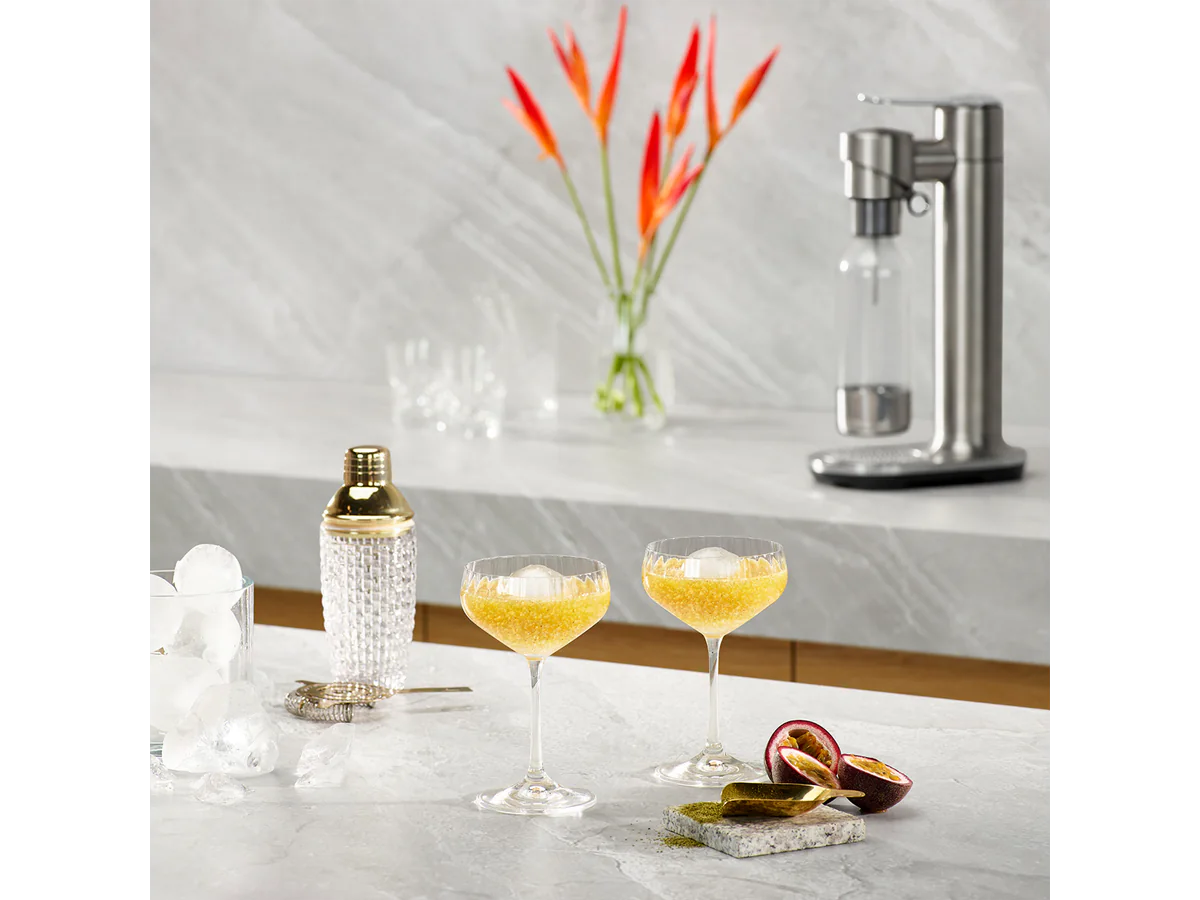 Breville InFizz Fusion with sparkling cocktails and citrus on a countertop