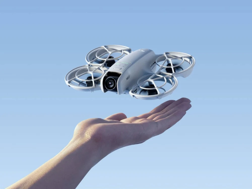 DJI Neo palm-launch drone hovering above a hand
