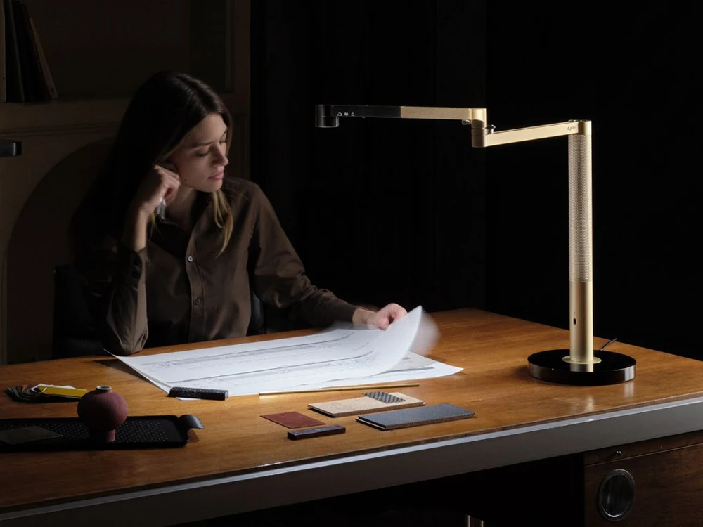 Dyson Solarcycle Morph Desk Light being used on a desk