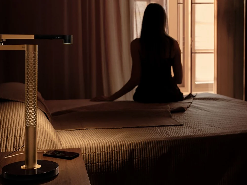 Dyson Solarcycle Morph Desk Light on a bedside table
