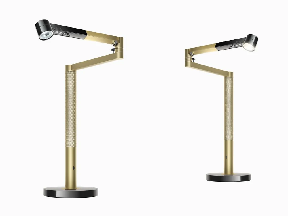 Two Dyson Solarcycle Morph desk lights with one on and one off