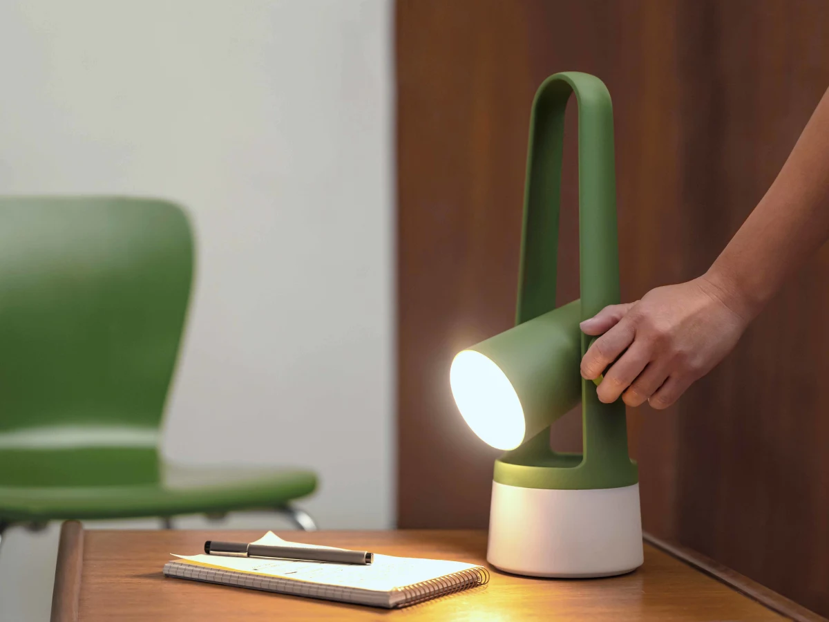 Gantri Aim Table Light illuminating a side table