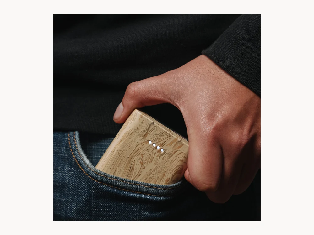 gomi Power Bank being pulled from a pocket