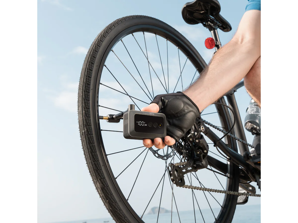 HOTO Air Pump Pocket inflating a bicycle tire