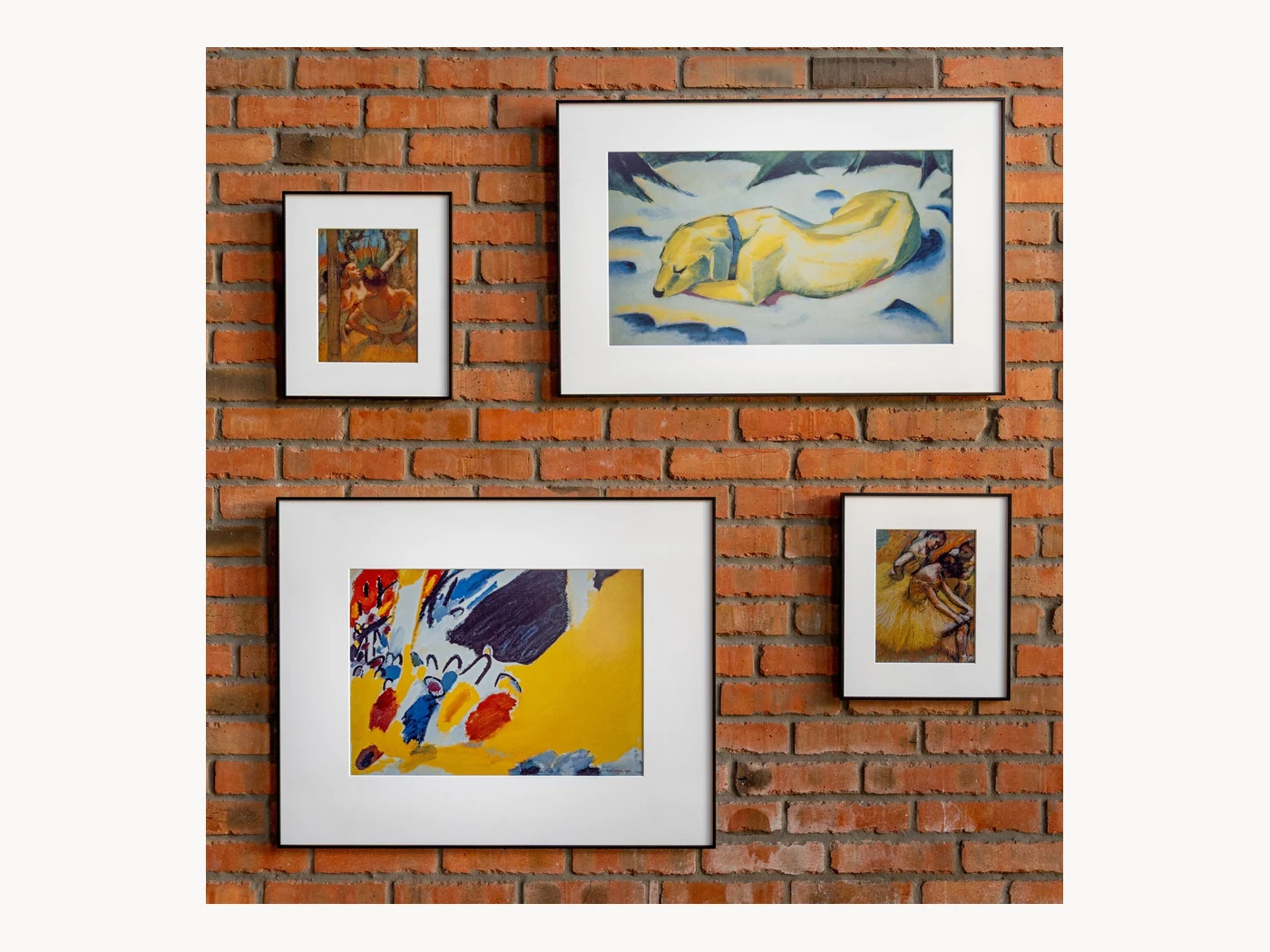 InkPoster art displays arranged on a brick wall