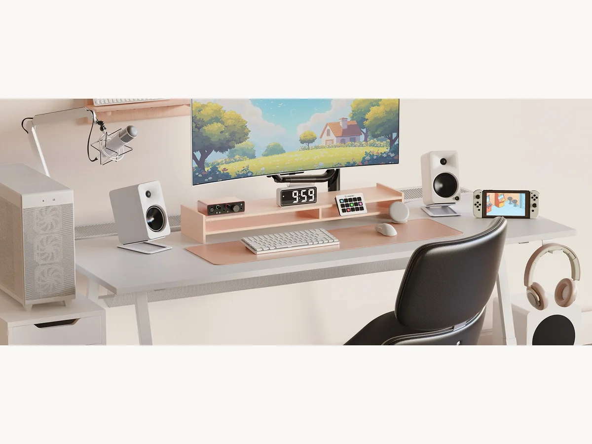White Kanto ORA4 speakers in a gaming desk setup