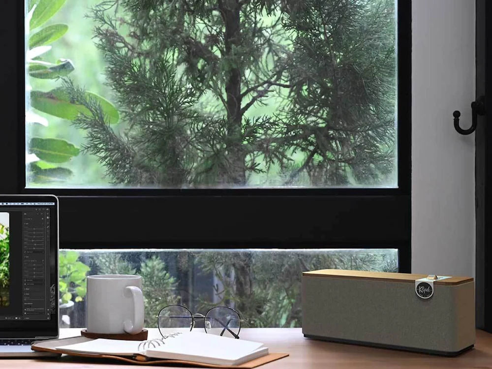 Klipsch The One Plus on a desk by a window