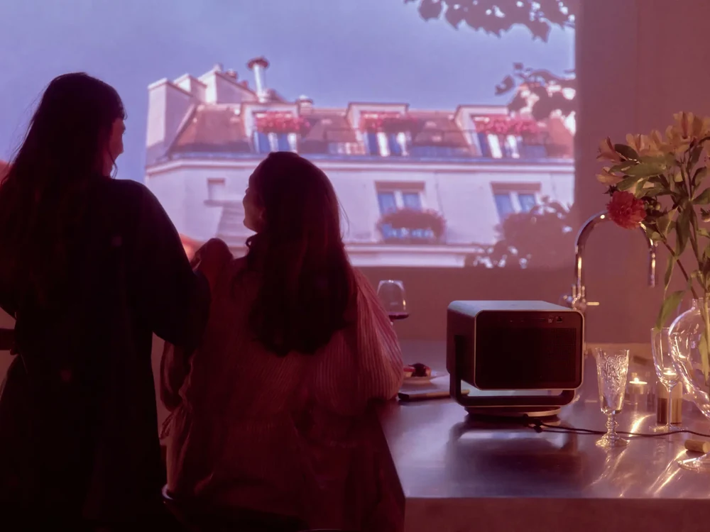 Leica Cine Play 1 projecting a movie in a home setting