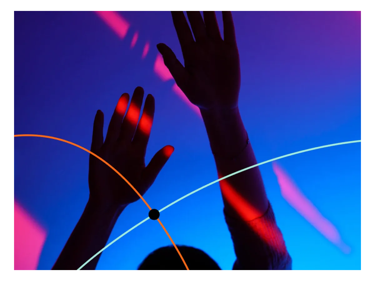 LIFX Luna color lighting effect with hands in front of a vivid wall