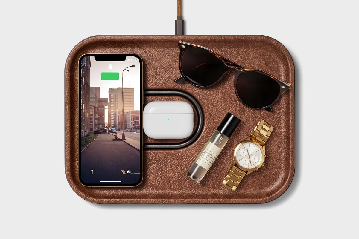 Courant MAG:3 Classics saddle valet tray with phone, earbuds, and daily carry items