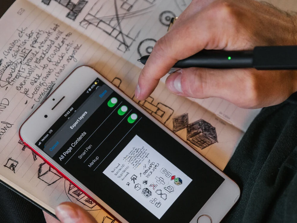 Moleskine Smart Writing Set in use with notebook and phone