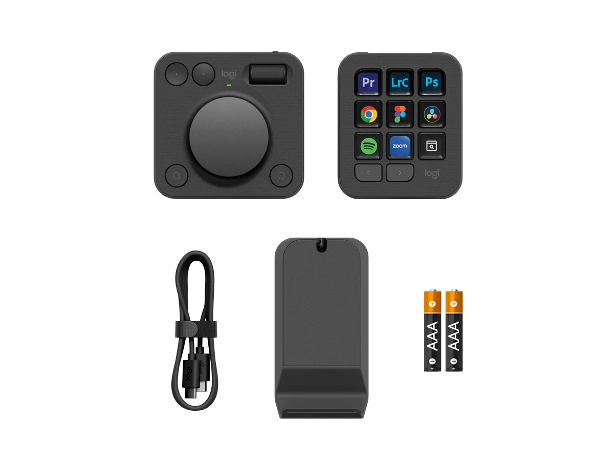 Logitech MX Creative Console kit contents with dial, keypad, cable, receiver, and batteries