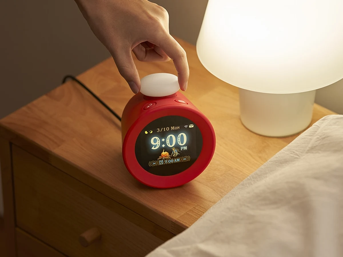 Nintendo Sound Clock Alarmo on a bedside table being adjusted