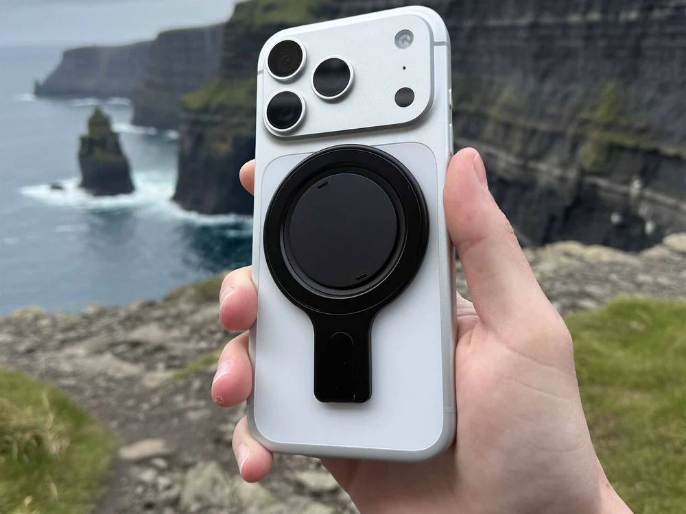 Ohsnap Snap Grip Stand attached to an iPhone outdoors
