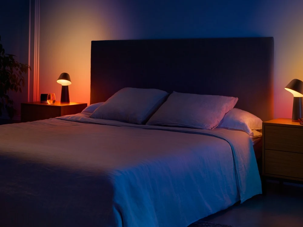 Philips Hue Twilight lamps lighting a bedroom at night