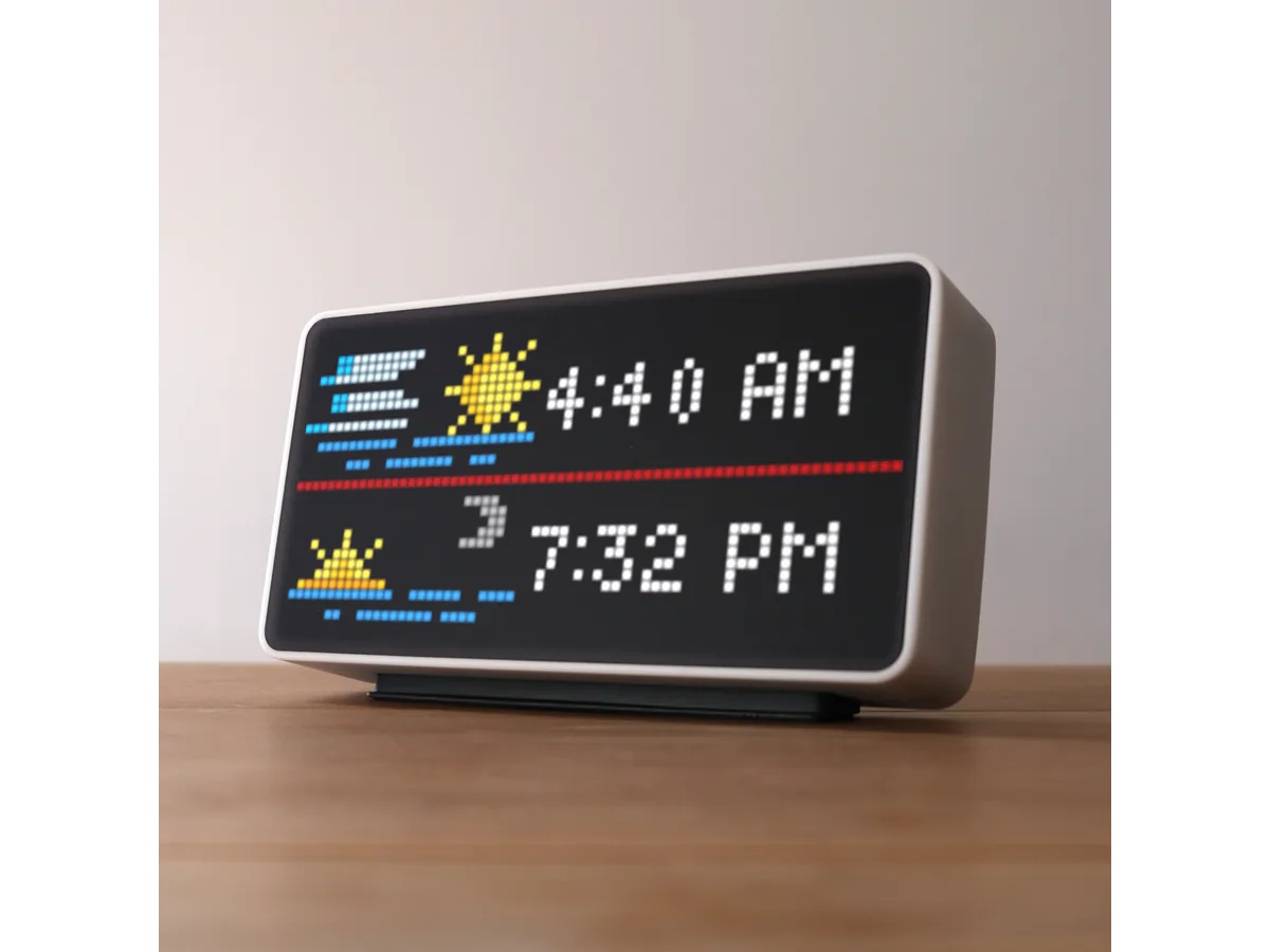 White Tidbyt Gen 2 display showing colorful pixel artwork