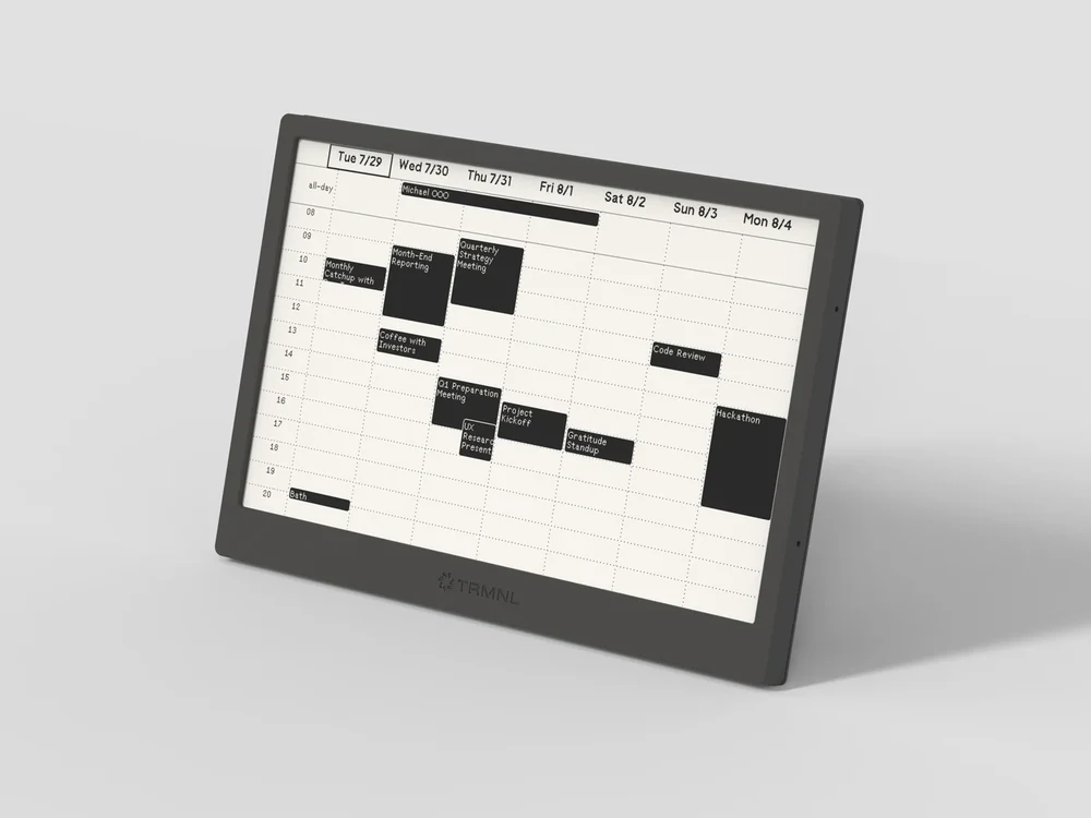 TRMNL OG black ePaper dashboard on stand