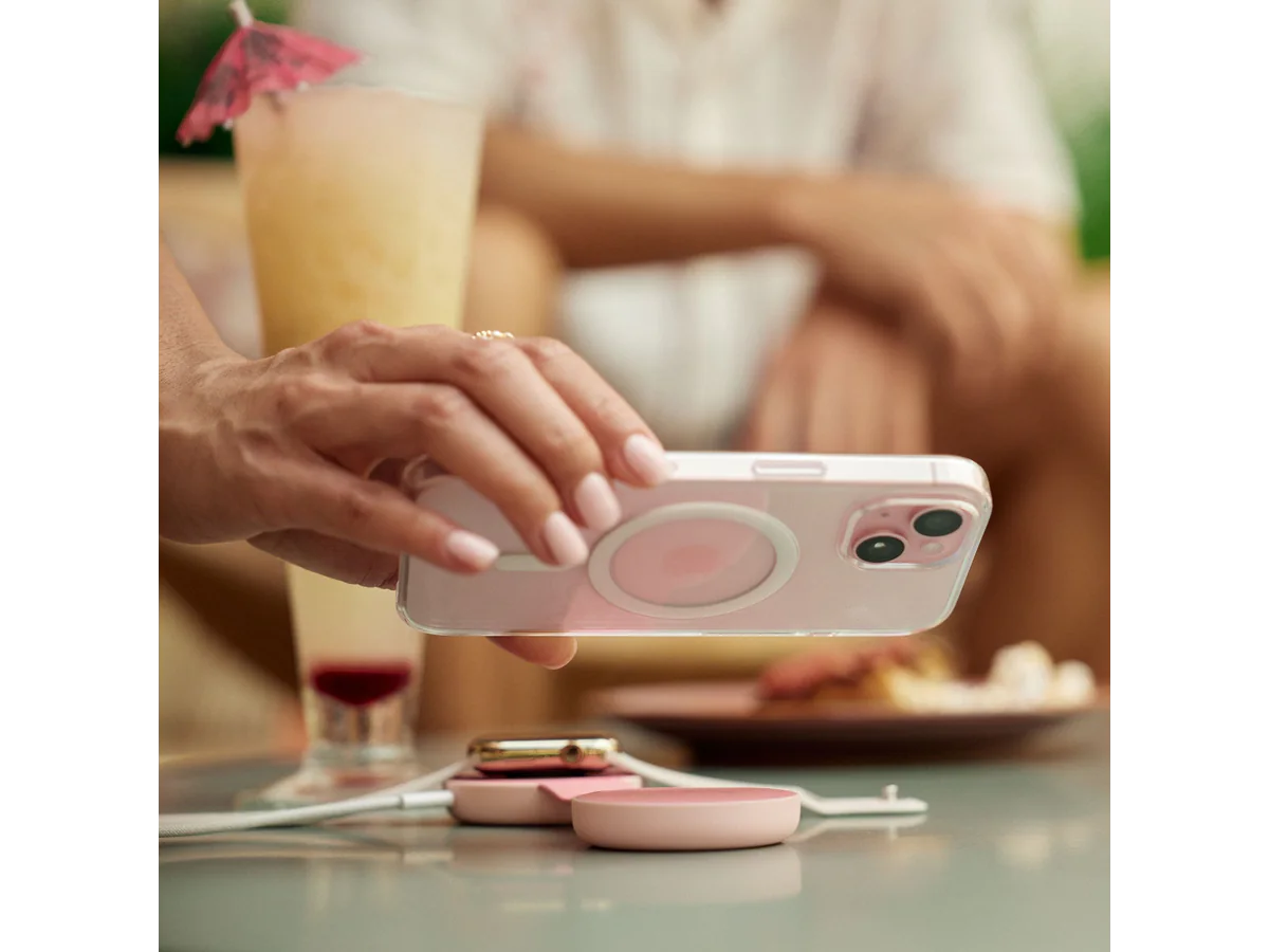 Twelve South ButterFly SE pink charger used as a MagSafe phone stand