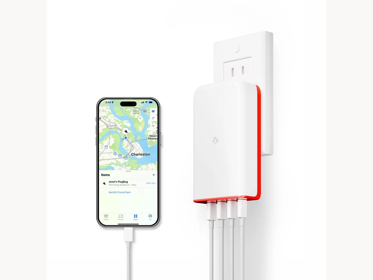 Twelve South PlugBug multiport charger plugged into a wall outlet beside an iPhone showing Find My