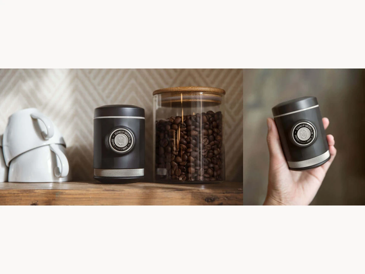 Wacaco Picopresso on a counter beside coffee beans and a kettle