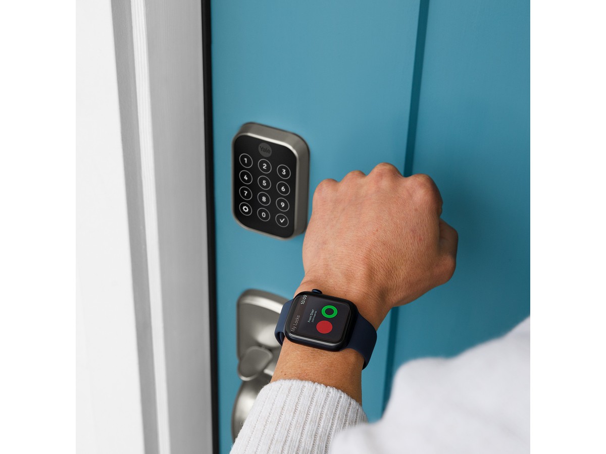 Yale Assure Lock 2 being unlocked from an Apple Watch on a blue front door