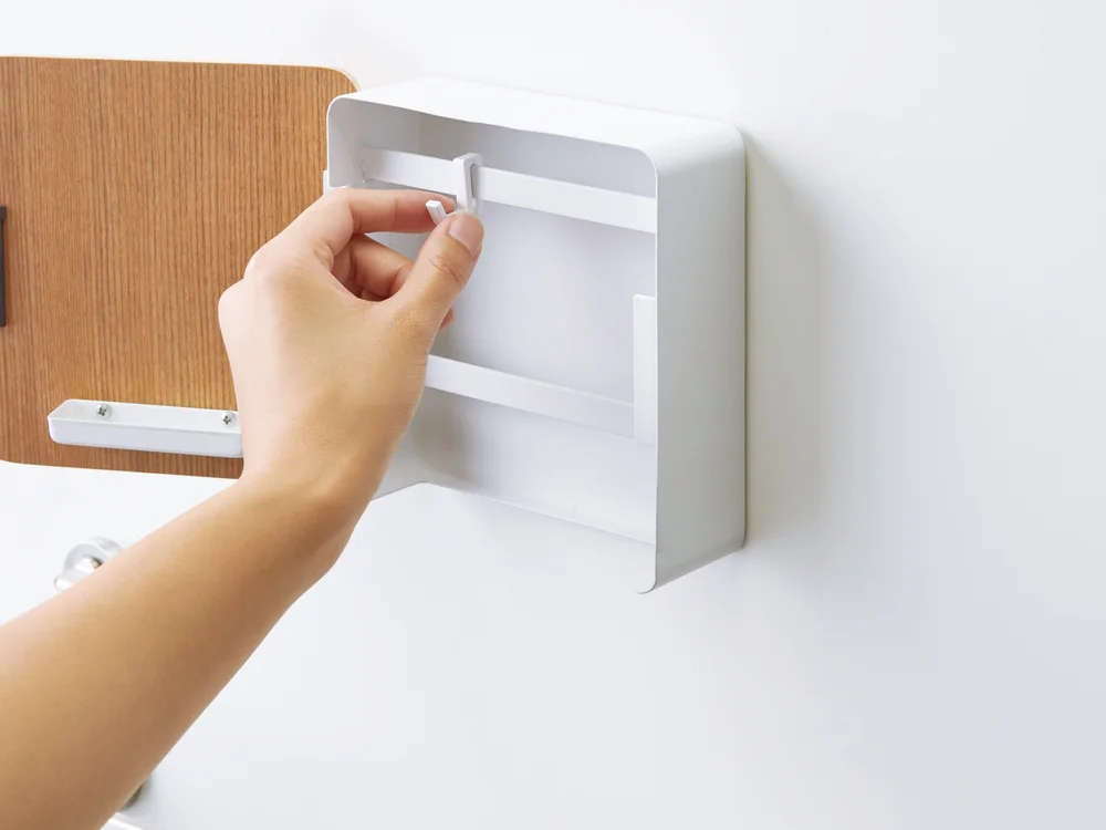 Hand opening the Yamazaki Home Rin Magnetic Key Cabinet