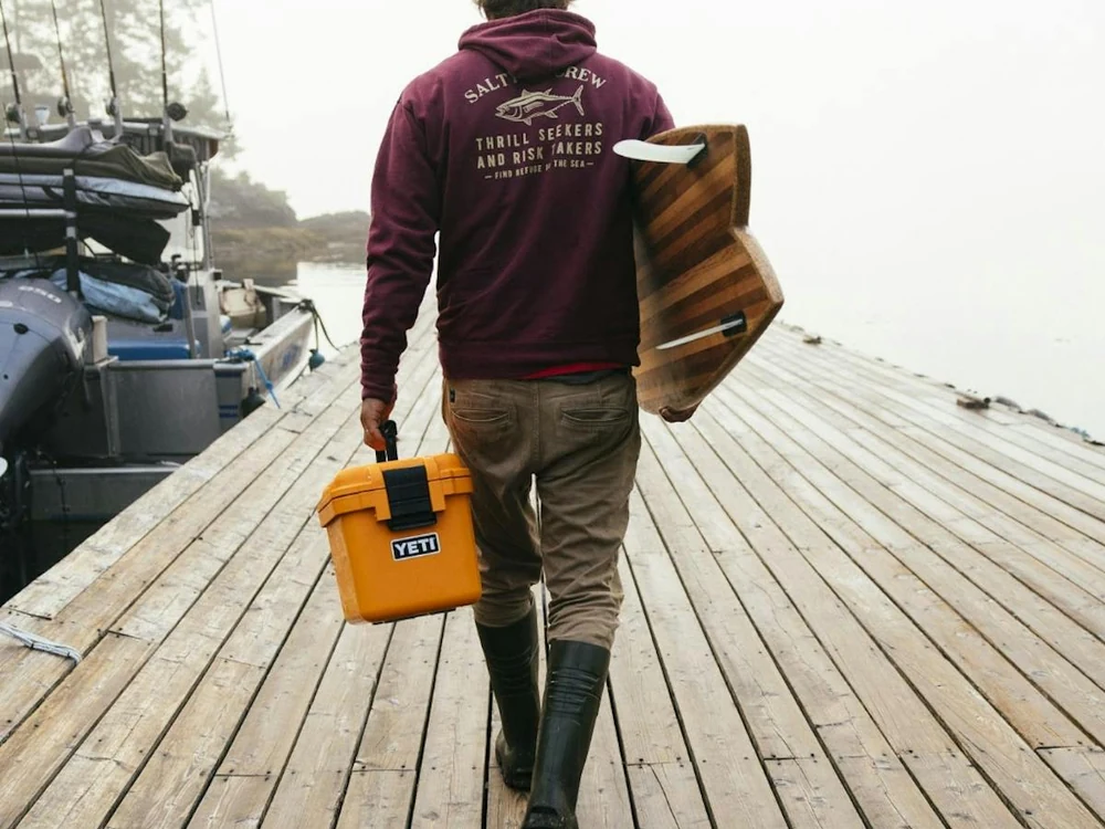 YETI LoadOut GoBox 15 carried on a dock with outdoor gear
